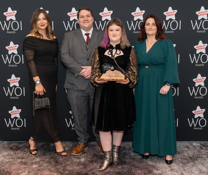 Angel with her award at the Woman of Influence awards 2025