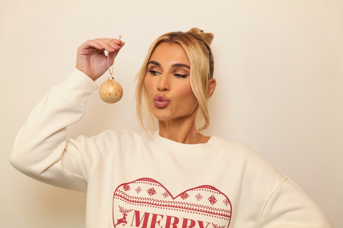 Billie Shepherd holding her personalised bauble