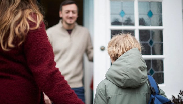 Boy being welcomed at new foster family's home
