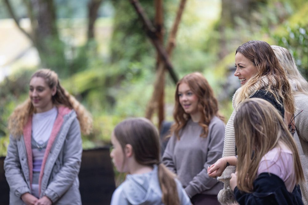 Charlotte Church smiling looking at young carers outdoors