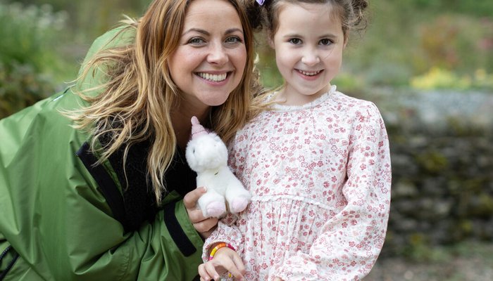 Charlotte Church smiling with young carer who is also smiling