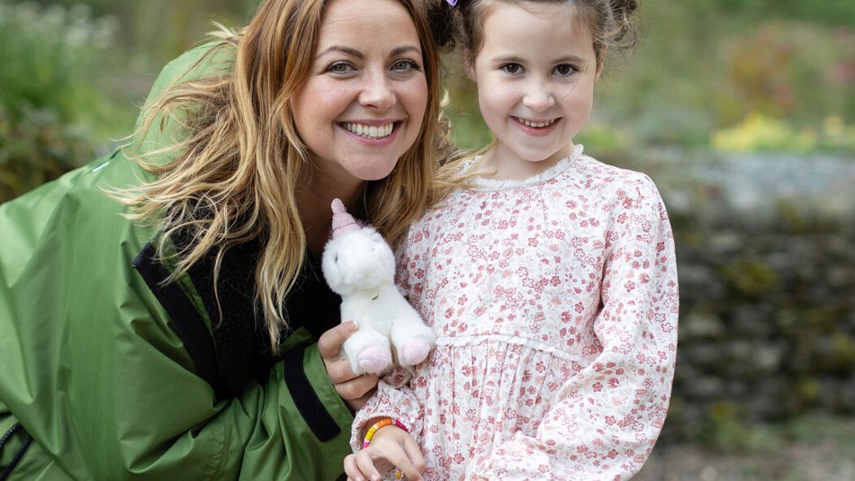 Charlotte Church smiling with young carer who is also smiling