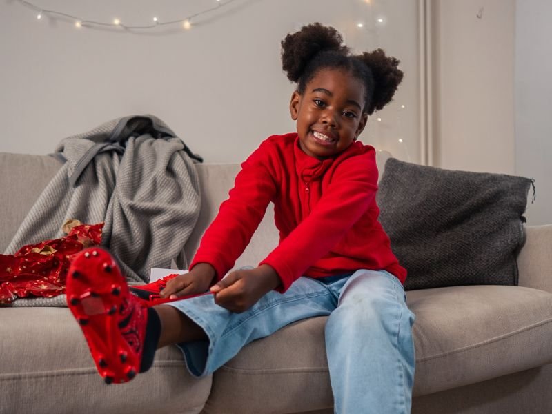 Chloe with football boots - landscape