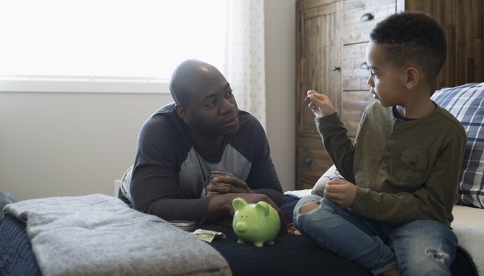 Dad teaching son about money