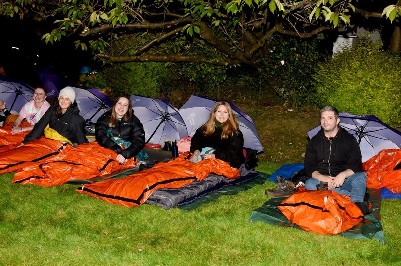 Group of people lying on sleeping bag participating in Boycott your Bed