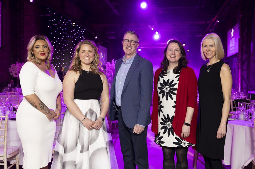 Guests pose for a picture togehter at the Women of Influence Awards