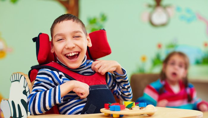 Happy boy in a wheelchair
