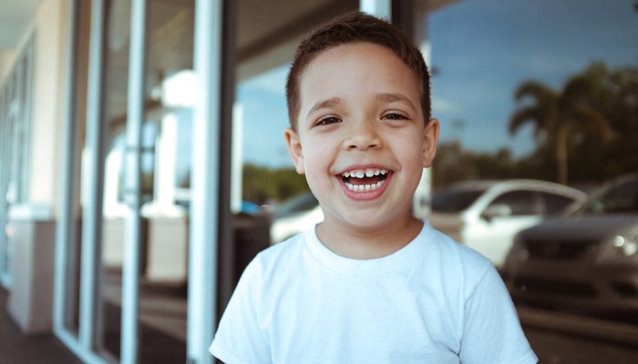 Happy boy smiling to camera