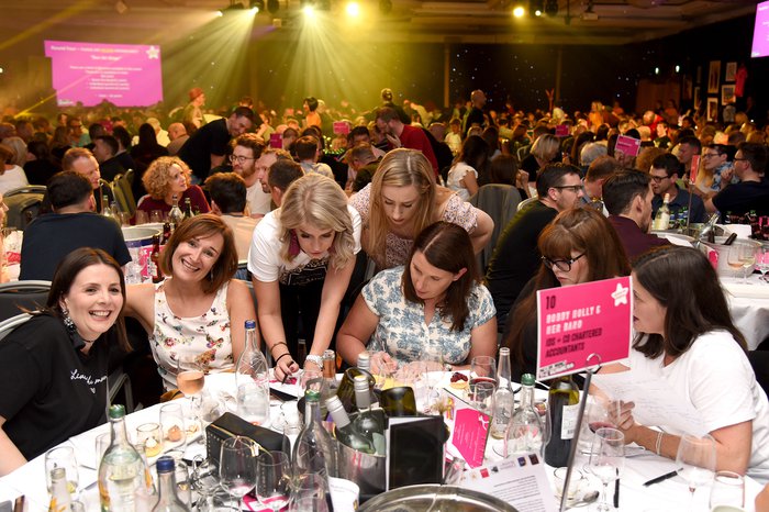 Happy group at Never Mind the Business music quiz