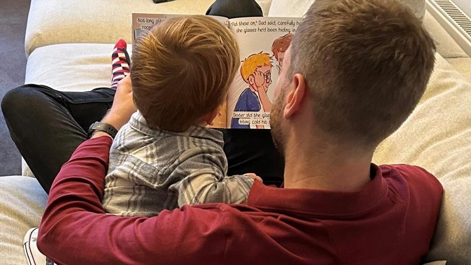 Jack Peedell and nephew reading his book "I Don't Know, Lets Find Out"