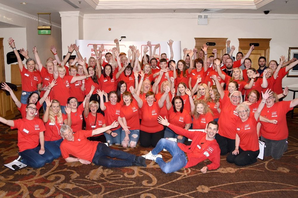 Large volunteer group wearing Action for Children t-shirt