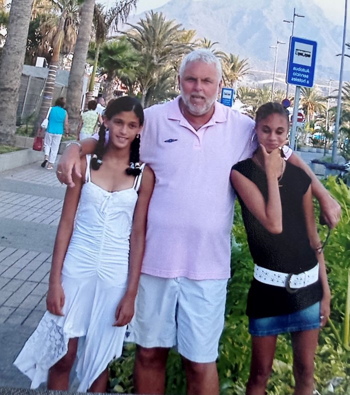 Lauren, Derrick, Sapphire pose for the camera on a sunny boulevard