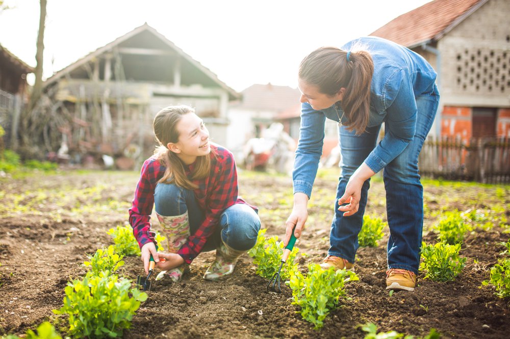 Mother and daughter working in garden.jpg