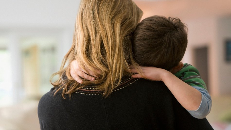 Mother comforting son