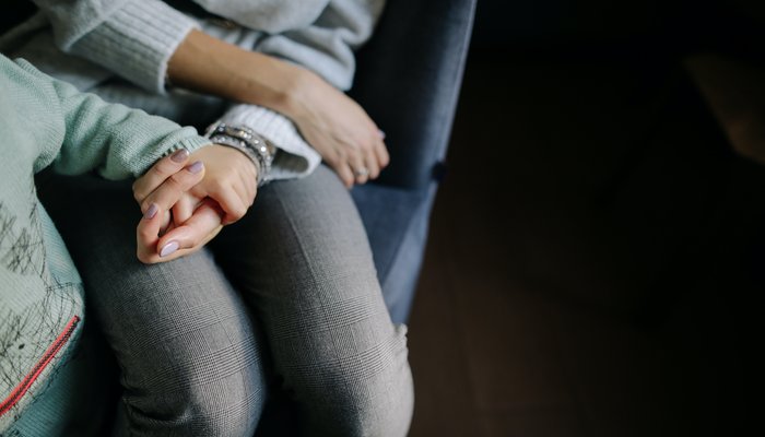 Mother and child holding hands