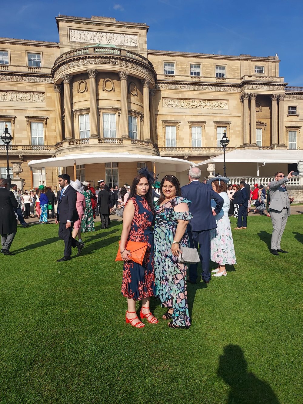 Raj and Amarjit outside outside Buckingham Palace at the Royal Garden Party