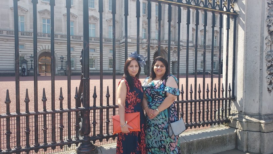Raj and Amarjit outside the gates of Buckingham Palace at the Royal Garden Party