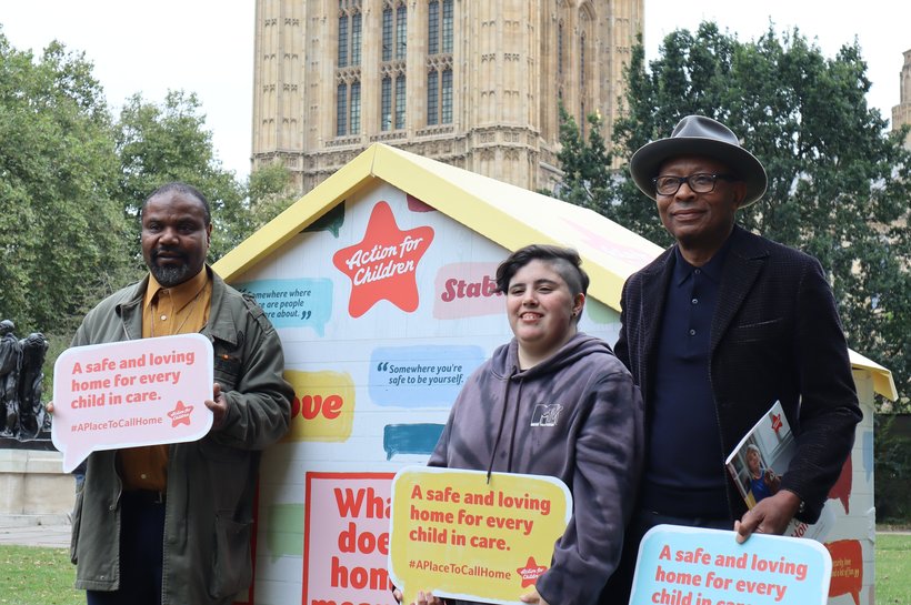Ronnie Archer Morgan standing in front of A Place to Call Home house