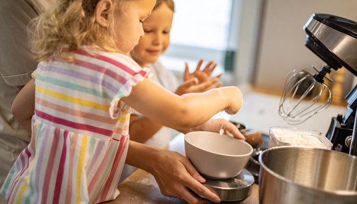 Child baking in kitchen