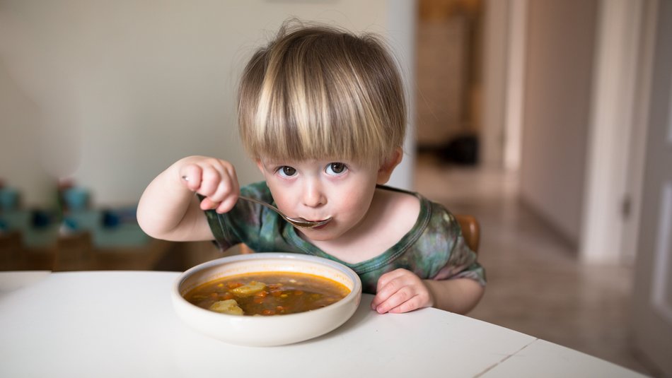 Child eating soup