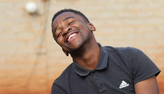 Teenage boy laughing