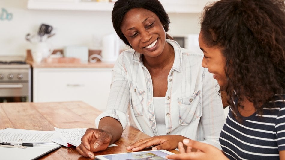 Teenager with carer smiling