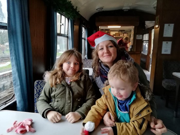 Thomas with his mum and sister on a Christmas train experience