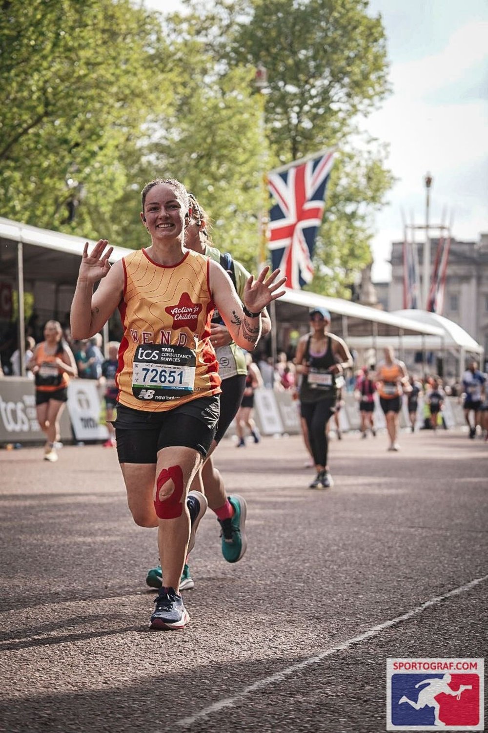 Wendy running and smiling during the London Marathon