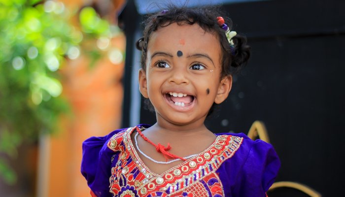 Young girl in colourful dress