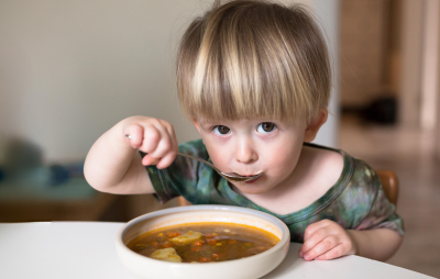 Boy eating soup thumbnail