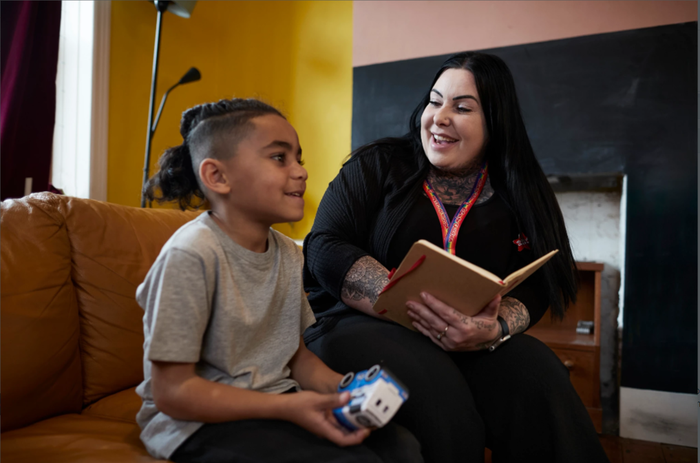 Action for Children support worker talking to boy