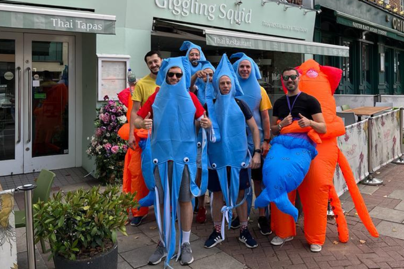 Giggling squid staff dressed up as squid outsie restaurant front