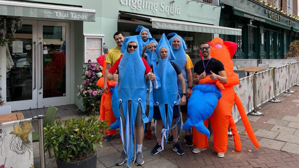 Giggling squid staff dressed up as squid outsie restaurant front