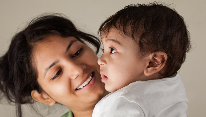 Mother and baby smiling