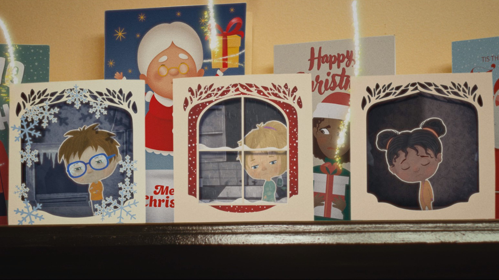 Secret Santa Christmas TV ad Festive mantlepiece with Christmas cards showing ilutrations of three sad children
