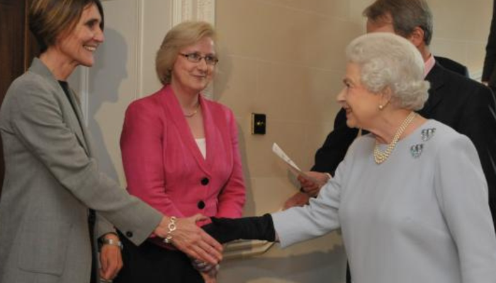 The Queen greeting Action for Children staff